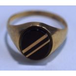 A 9 carat gold signet ring, set with an oval onyx having diagonal gold bands, finger size Q, 2.