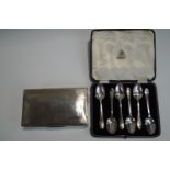 A cased set of six silver teaspoons; with a silver cigarette box; 86 g (2.