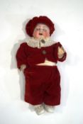 A 1920's/30's French baby doll, in later clothes.
