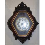 A French 'vineyard' wall clock,the hexagonal case with ornate carved scroll and shell detail,