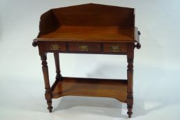 A Victorian mahogany wash stand, with side hanging rails and under tier shelf,