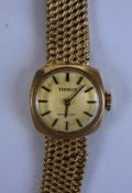Tissot, a lady's 9 carat gold bracelet watch, the circular gilt dial with black batons and hands,