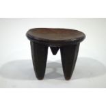 A carved African hardwood stool,