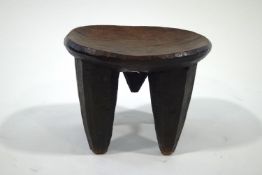 A carved African hardwood stool,