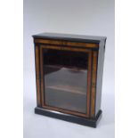 A Victorian ebonised inlaid pier cabinet, parquetry star motifs to the borders,