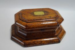 A 19th Century octagonal oak company seal box, with brass plaque inscribed, 'A.V.I.