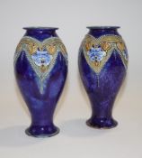 A pair of Royal Doulton stoneware vases, of waisted baluster form,