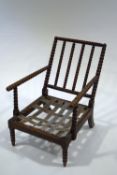 A late Victorian oak bobbin turned armchair,