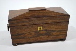 A late Regency rosewood tea caddy of sarcophagus form,