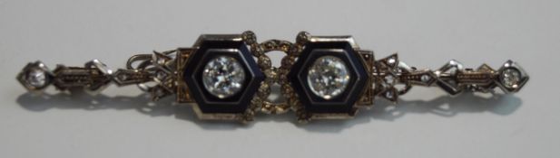 A two tone diamond brooch, the brilliant cut diamonds totalling approximately 1 carat,
