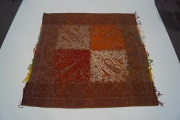 An Indian woven shawl with paisley style design,