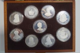A set of nine silver Queens of the British Isles coins,