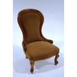 A Victorian style mahogany nursing chair, with spoon back,