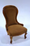 A Victorian style mahogany nursing chair, with spoon back,