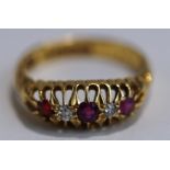 An 18 carat gold five stone ruby and diamond ring, Birmingham 1915, finger size L, 2.