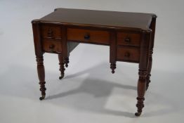 A Victorian mahogany side table, with five drawers, upon turned legs,