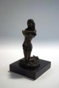 A modern bronze of a lady undressing, signed Ponsard, on a black marble base,