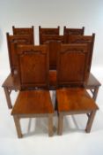 A set of eight modern oak dining chairs,