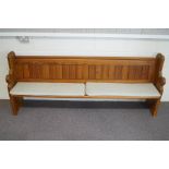 A 20th Century pine Church pew, with cushions,