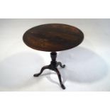 A George III style oak tilt top table,