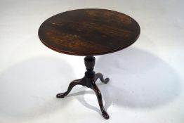 A George III style oak tilt top table,