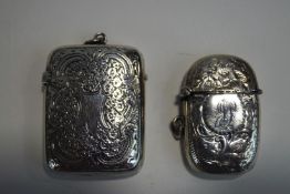 A silver vesta case;