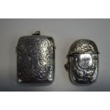 A silver vesta case;