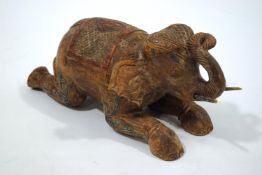 A carved wood and painted Indian elephant,