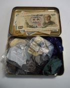 A collection of bank notes and various coins, including foreign, pennies, crowns,