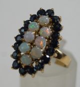 An opal and sapphire cluster ring, stamped '585',