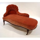 A Victorian mahogany chaise longue, with red button back upholstery,