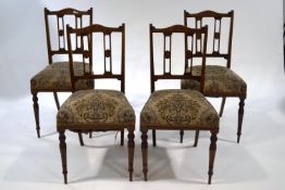A set of four Edwardian chairs, the backs inlaid with patera,