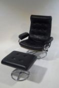 A vintage leather and chrome button back swivel chair,