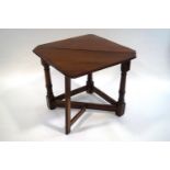 A 18th Century style oak credance table, with gateleg action operating a single flap,