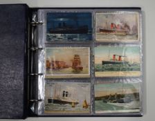 A large collection of Victorian postcards in four albums,