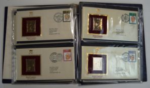 An album containing 22 carat gold replicas of British Stamps