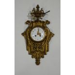 A 20th Century French gilt metal Cartel clock,with pendulum and winding key,