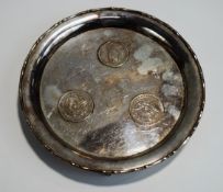 A Chinese coin set salver, stamped 'Wai Kee', Sterling Silver' and 'Made in Hong Kong',