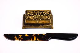 A tortoiseshell paper knife and a brass stamp box