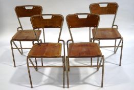 A set of four Cox of Waterford stacking chairs with metal frames