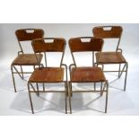 A set of four Cox of Waterford stacking chairs with metal frames