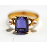 A three stone tanzanite and pearl ring, stamped '18ct, finger size P1/2,