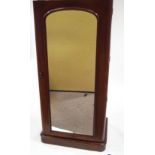 A Victorian mahogany single wardrobe with mirrored door,