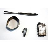 A Victorian unmarked silver Aesthetic Movement locket, of rectangular outline,