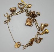 A 9 carat gold bracelet, of filed curb links, with charms attached, 13.