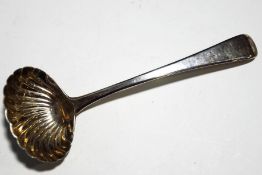 A George III silver old English pattern sauce ladle with a shell bowl,