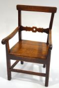 An antique oak country armchair,