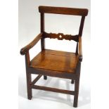 An antique oak country armchair,