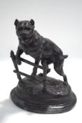 A bronze of a tethered bull mastiff, signed C.
