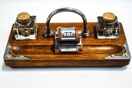 A Victorian oak ink stand with plated mounts,
